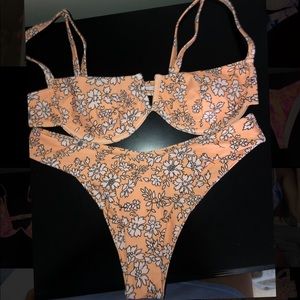 Floral light orange bathing suit. Top is wired